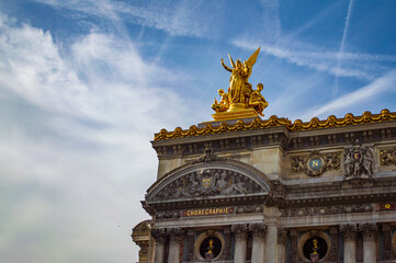 Paris, France - July 19, 2019: Golden statue on top of the National Opera of Paris, France