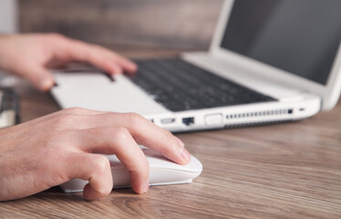  Male hand clicking computer mouse. Internet. Business. Technology