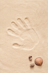 Fototapeta na wymiar hand print in sand