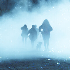 people walking on the street with fog in Bilbao city, spain