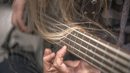 musician playing guitar, close up