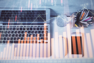 Multi exposure of forex graph drawing over desktop background with computer. Concept of financial analysis. Top view.