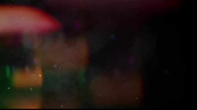 Alpha channel light leaks. Multicolored light leaks footage on black background. For compositing over your footage, stylizing video, transitions. 