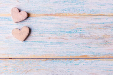 Two decorative hearts on old wooden background with copy space. Valentine’s day concept