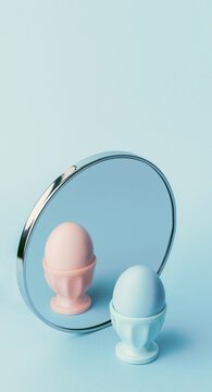 gender identity problem concept. the egg is blue in front of the mirror in the reflection it is pink.