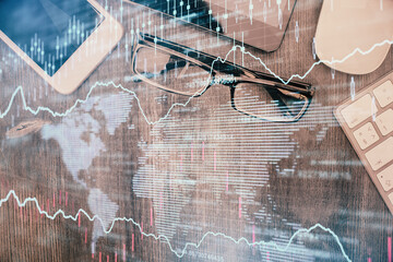 Multi exposure of forex graph hologram over desktop with phone. Top view. Mobile trade platform concept.