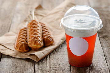 Cheese tea and waffle lollies on a rustic wooden table