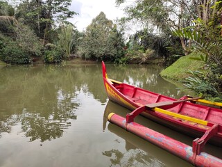 Medan, Indonesia - January 3, 2021: a ship on the edge of a lake in a park, Medan City, Indonesia.