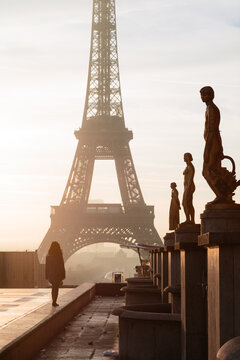 Woman looking at the Eiffel tower, Paris, Ile de France, France