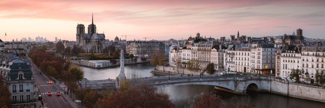 Panorama of Paris and Notre Dame cathedral at sunset, France