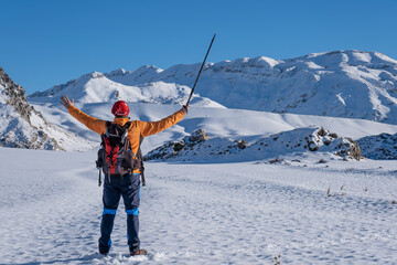 successful and proud trip of the professional mountaineer in the snowy mountains