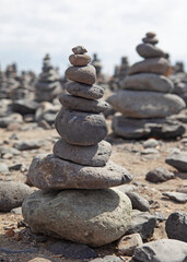 Fototapeta na wymiar a big stack of stones on beach