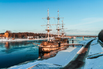 Sailboat on the Volkhov River. Winter view of a frozen river. Veliky Novgorod, Russia