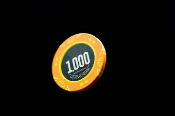 a Casino chip over black background