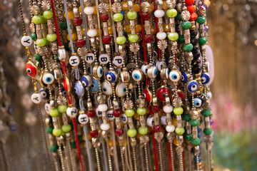 Closeup of beautiful unique shiny and colorful accessories in the market