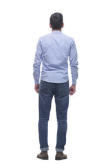 rear view . a young man in jeans looking at a white screen.