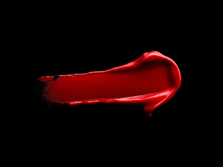 Red lipstick smear isolated on black background