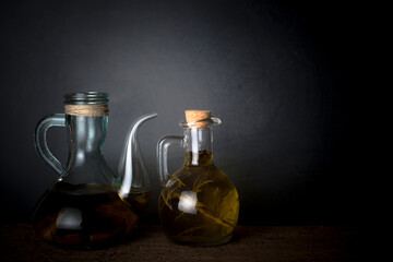 Obraz na płótnie Canvas Extra virgin olive oils flavored with rosemary and garlic.