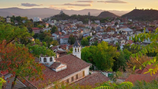 Beautiful houses in the old town of Plovdiv surrounded by green hills. Plovdiv city center, Bulgaria. Sunset light