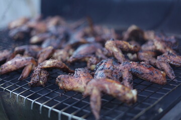 Jamaican Jerk chicken wings in smoker grill