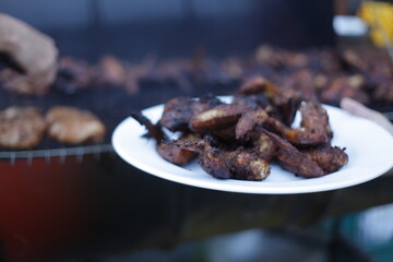 Jamaican Jerk chicken wings in smoker grill