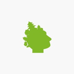 Silhouette of man's head with forest in hair. Green avatar with trees.