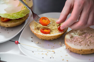 Preparation steps of homemade hamburger with fresh vegetables, spices, cheese and meat