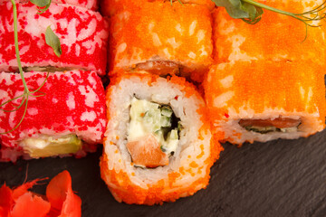 Set of salmon sushi and rolls with salmon and eel, top view