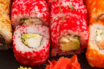 Set of salmon sushi and rolls with salmon and eel, top view