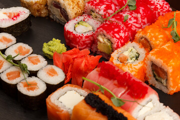 Set of salmon sushi and rolls with salmon and eel, top view