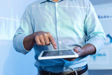 cropped view of businessman pointing with finger at digital tablet with blank screen