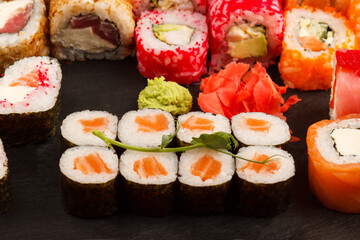 Set of salmon sushi and rolls with salmon and eel, top view