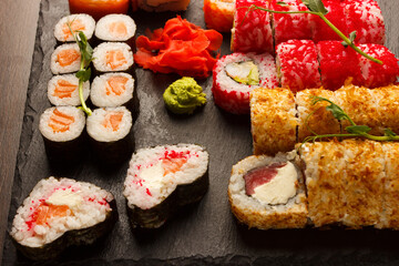 Set of salmon sushi and rolls with salmon and eel, top view