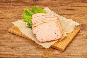 Boiled pork sausage over board