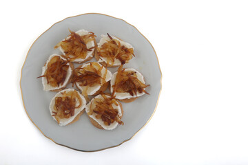Mozzarella and fried onion toast canape as appetizer