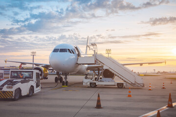 Fototapeta na wymiar Empty Passenger Airplane in Airport at Sunset