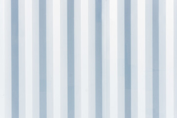 Corrugated metal texture. Metal sheet background. Tinware lines pattern. Grunge wall siding background. Striped industry construction.