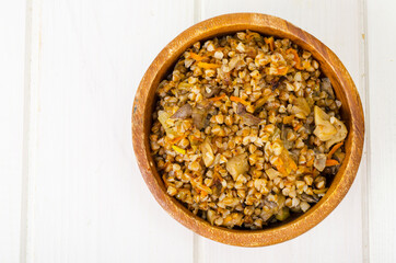 Boiled buckwheat porridge with stewed mushrooms and vegetables.