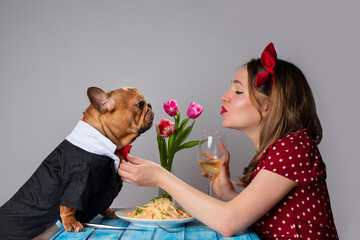 young girl on romantic valentine's day date with her dog french bulldog