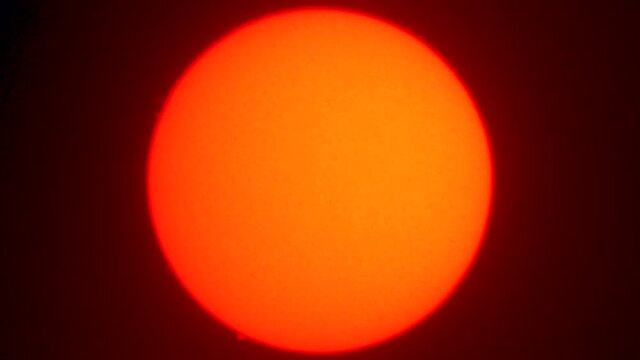 A view of the Sun full disk with an H Alpha telescope. Some flares going out from the Sun sphere at the limb could be seen like red flares going to the outer space. A nice view of our star the Sun