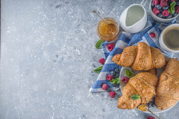 Sweet breakfast croissants with jam and berries