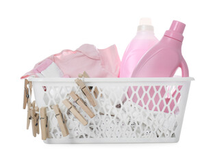 Detergents and children's clothes on white background