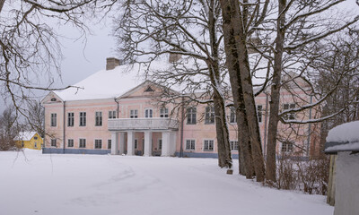 old manor in winter time, europe, estonia