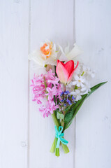 Bouquet of spring garden flowers on white background.