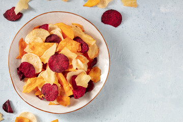 Vegetable chips, overhead flat lay shot, a healthy vegan snack, with copy space