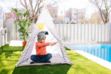 Little boy playing in a indian tent © Victor