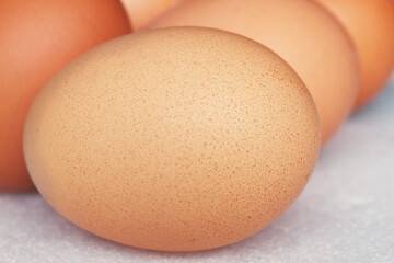 close-up of brown eggs piled up