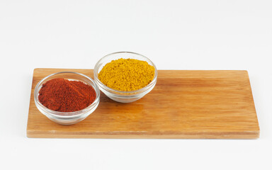 Assorted spices on wooden board