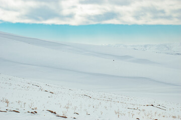 snow covered mountains and blue sky