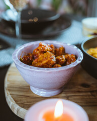 Delicious Indonesian take away foods hold in hands, rendang, beans, shrimps, crisps, tofu, rice, bami, restaurant in the Netherlands